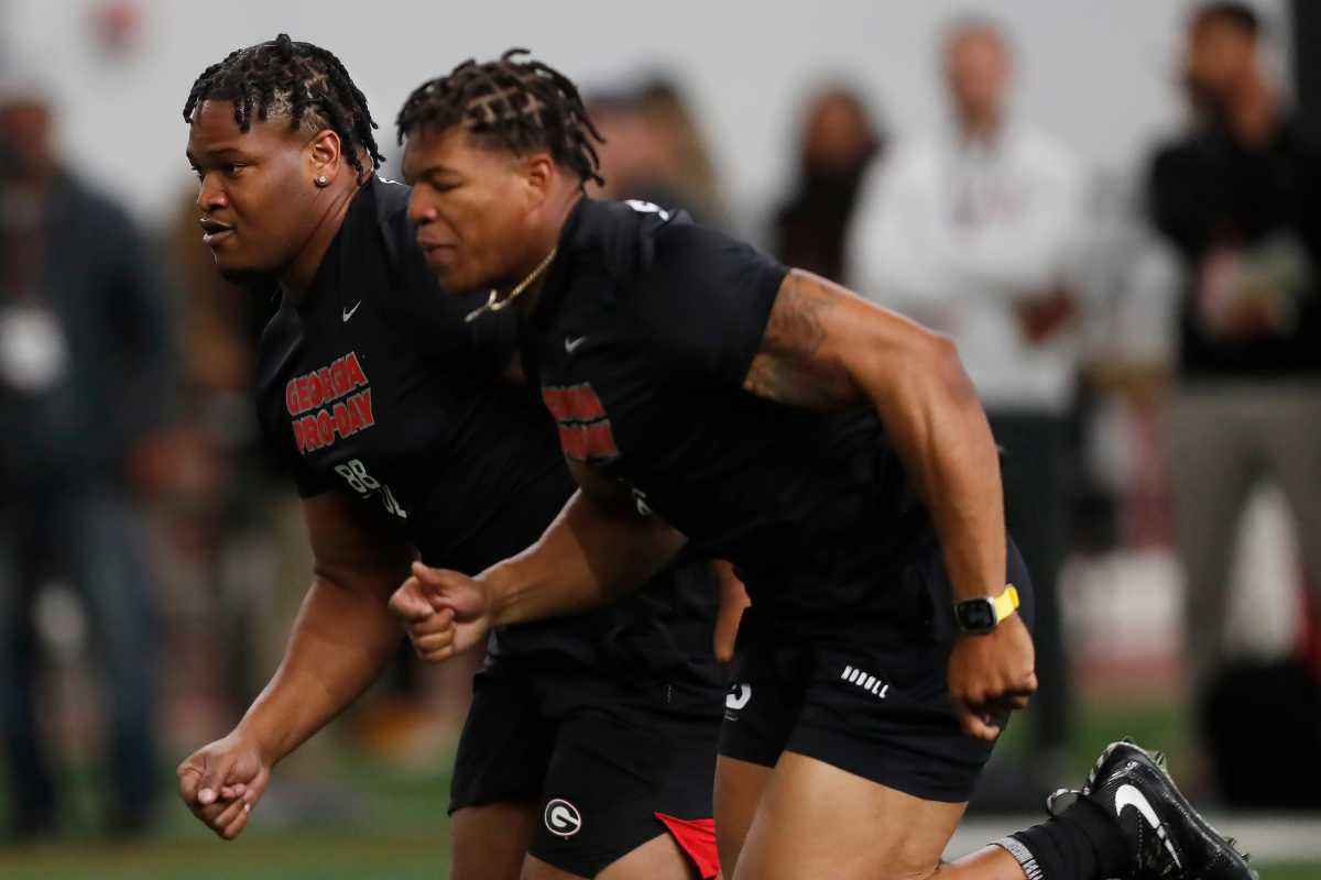 Jalen Carter and Nolan Smith run side by side